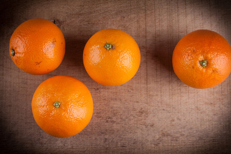 Oranges ona wood tableの写真素材
