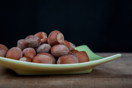hazelnuts on a plateの写真素材