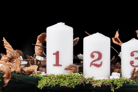 Advent candles on a black backgroundの写真素材