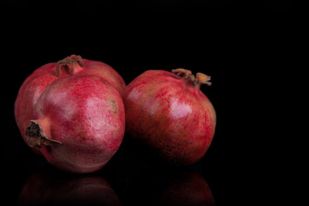 pomegranates on a black backgroundの写真素材