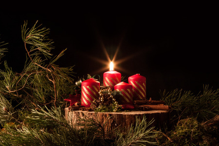 Advent candles on a black backgroundの写真素材