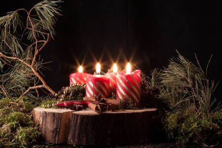 Advent candles on a black background