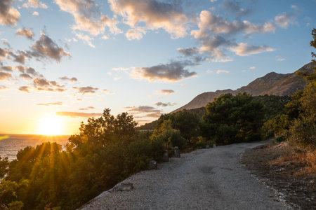 sunset over the sea in Croatia, in the town of Drvenikの写真素材
