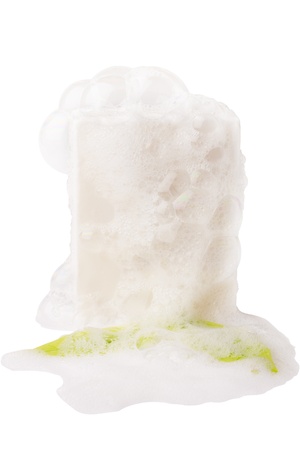 white soap, bubbles and leaf on white with clipping pathsの写真素材