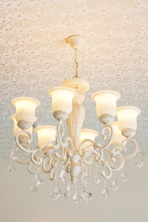 vintage white chandelier on ceilingの写真素材