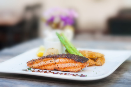 grilled salmon steak on wood table.の写真素材