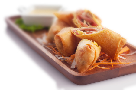 Ham & cheese with mushroom & truffle oil spring roll, on white.