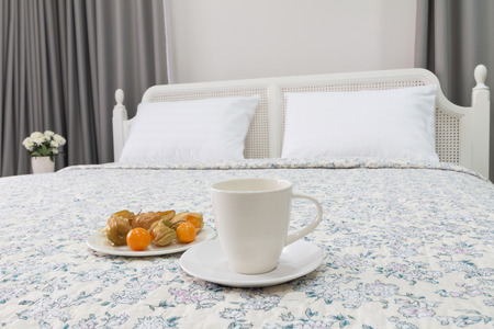 contemporary and classic bedroom with tea cup and cape gooseberry.