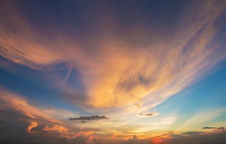 fluffy clouds in sunset sky.の写真素材