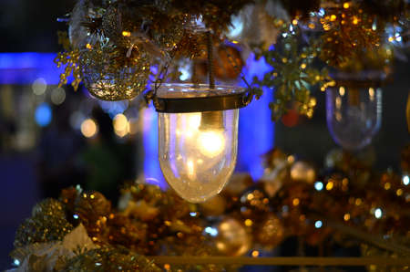 Gold light holding christmas with blurred background