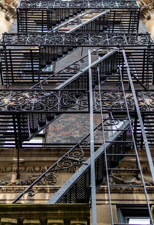 Ornate fire escape on an apartment building in lower Manhattan.の素材 [FY310133554566]