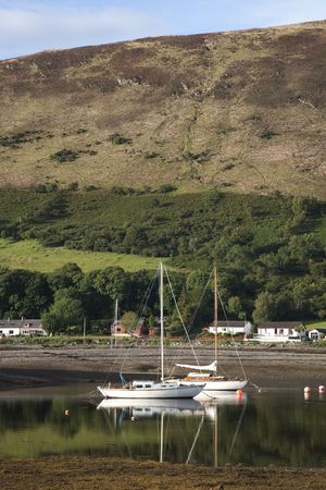 Boats in Lochranza in the Isle of Arran, Scotlandの写真素材