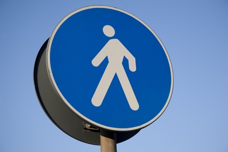 Pedestrian Sign against Blue Sky Backgroundの写真素材