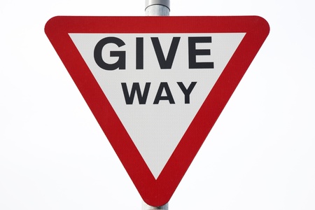 Give Way Sign on White Backgroundの写真素材