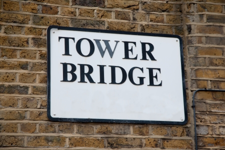Tower Bridge Sign in London, England, UK on Brick Wallの写真素材
