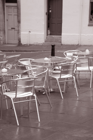 Cafe Tables and Chairs in Black and White Sepia Toneの写真素材