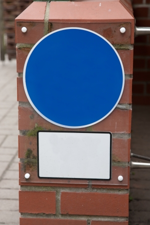 Blue Blank Circle and White Square against Red Brick Wall Backgroundの写真素材