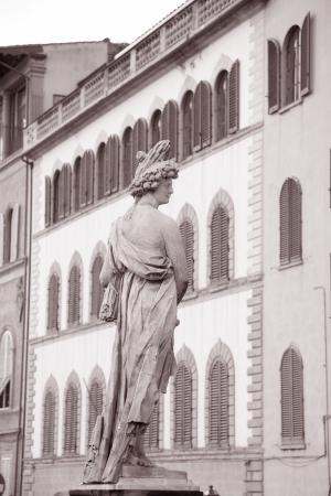 Statue on Ponte Santa Trinita Bridge in Florence; Italyの写真素材