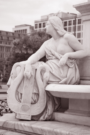 Deatil on the Schiller Statue outside Concert Hall, Berlin, Germany in Black and White Sepia Toneの写真素材