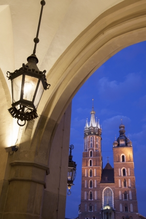 Cloth Hall and Lamp with Mariacka Basilica Church; Krakow; Poland, Illuminated at Nightの写真素材
