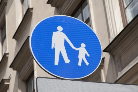 Blue Pedestrian Sign in Urban Settingの写真素材