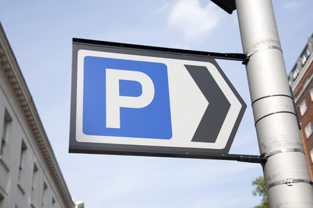 Blue Parking Sign in Urban Settingの写真素材