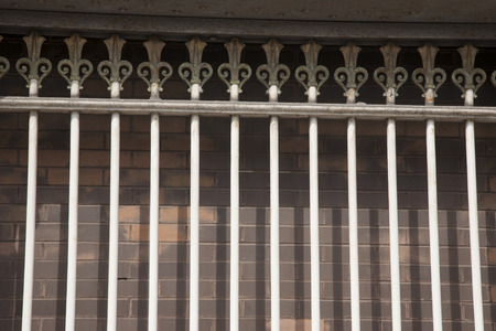 White Metal Railings on Brick Wall Background