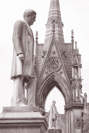 Oliver Heywood Statue by Joy (1894) and Albert Memorial by Noble (1867), Albert Square, Manchester, England in Black and White Sepia Toneのeditorial素材