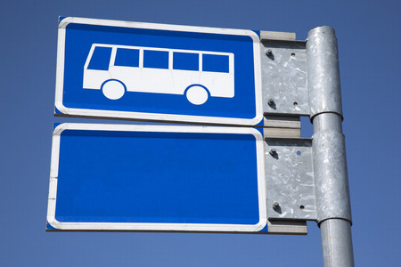 Blue Bus Sign against Sky Backgroundの写真素材