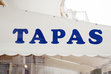 Blue Tapas Sign in Urban Settingの写真素材