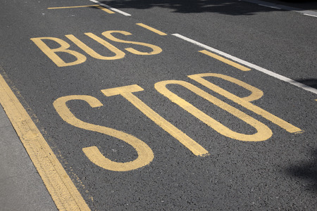 Bus Stop Sign Painted on Roadの写真素材