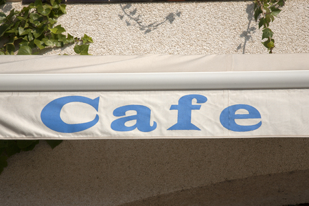 Cafe Sign against Building Backgroundの写真素材