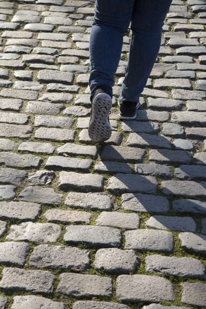 Cobble Stones and Person Walking, Saragossa, Aragon, Spainの写真素材