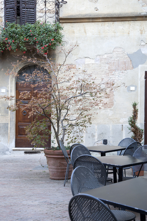 Cafe Table and Chair in Square on Street in Tuscany, Italyの写真素材