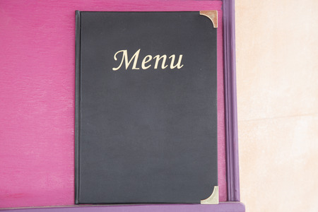 Menu Book on Pink Backgroundの写真素材