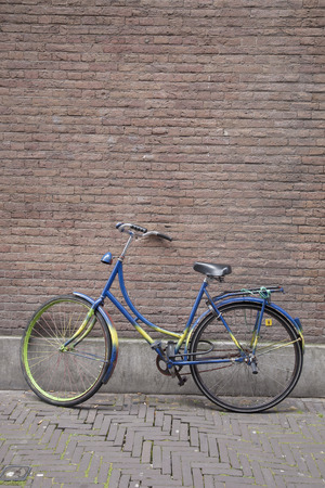 Colorful Bike against Wall, Holland, Netherlandsの写真素材