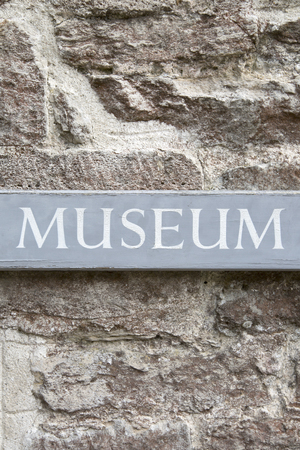 Closeup of Museum Sign on Stone Wallの写真素材