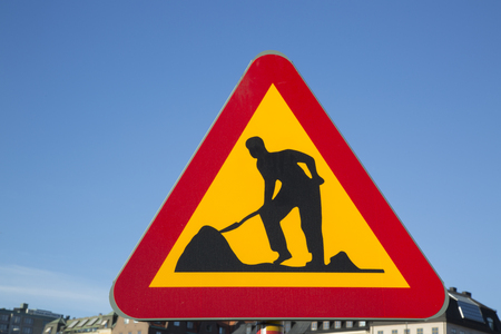Roadworks Sign in Urban Settingの写真素材