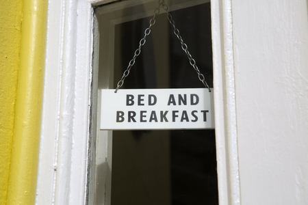 Bed and Breakfast Sign on Hotel Windowの写真素材