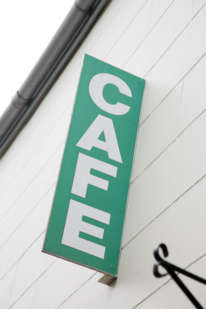 Green Cafe Sign on Diagonal Slantの写真素材