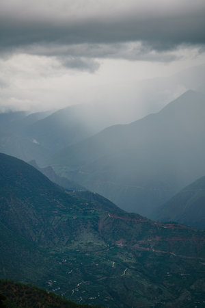 mountain landscape surrounded by clouds and mist