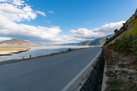 Asphalt road on the coast of Lake Baikal, Siberia, Russiaの写真素材