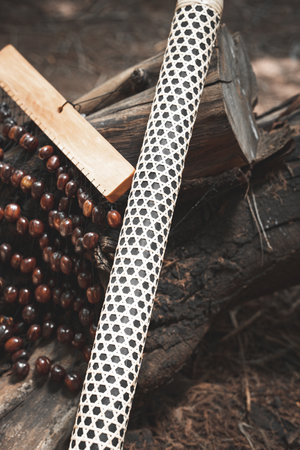Bracelet made of beads on a wooden background. Selective focus.