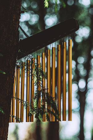 Wind chimes in the forest - vintage filter effect and selective focus pointの写真素材