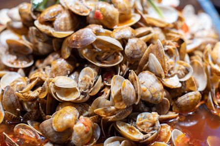 Clams cooked in a sauce with garlic and chili pepper.の写真素材