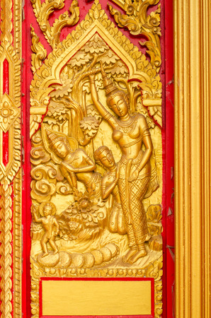 Golden Buddha Carving on the door,Thailandの写真素材