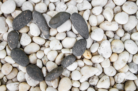 Background texture of stone wall with heart shape by stonesの写真素材