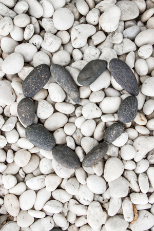 Background texture of stone wall with heart shape by stonesの写真素材