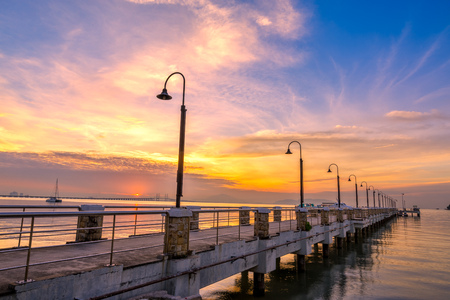 Golden sunrise at jettyの写真素材