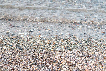 the sea that comes onto a beach of shells